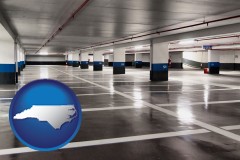 north-carolina map icon and an empty parking garage
